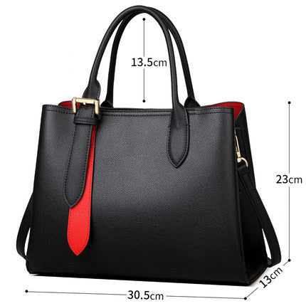 A black leather handbag with dimensions