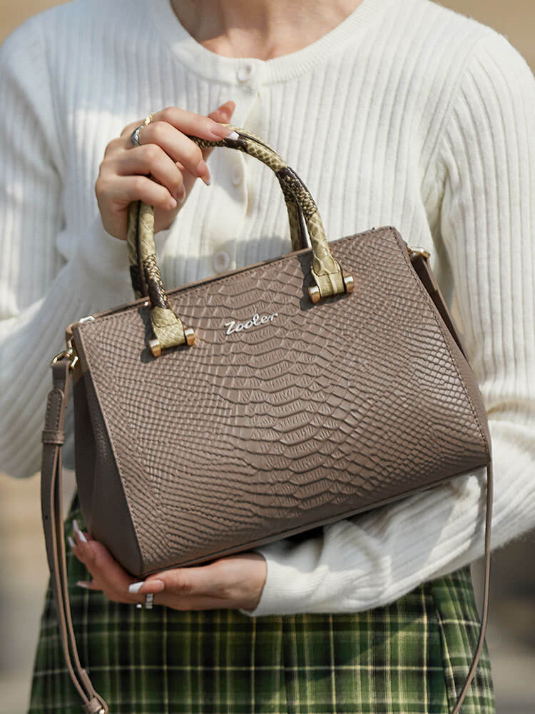 Model carrying Khaki Snake Skin Handbag