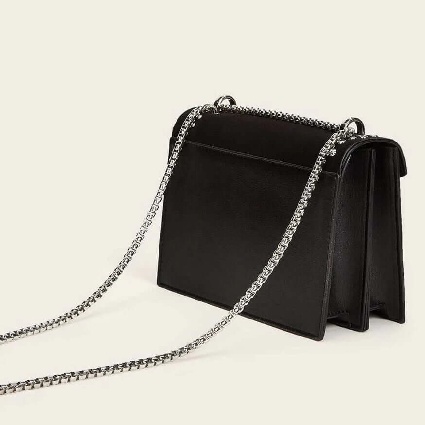 A black studded vegan leather bag