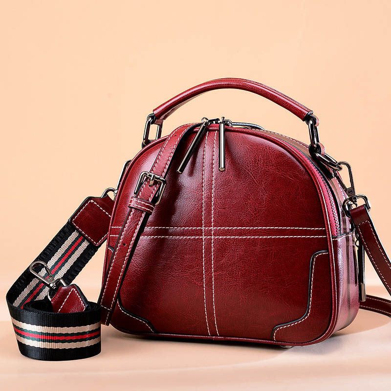 Red round leather bag