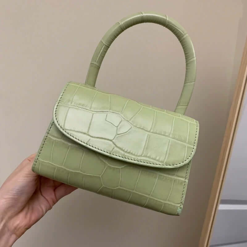 A light green mini crossbody bag