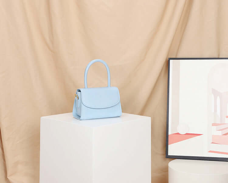 A light blue mini crossbody bag