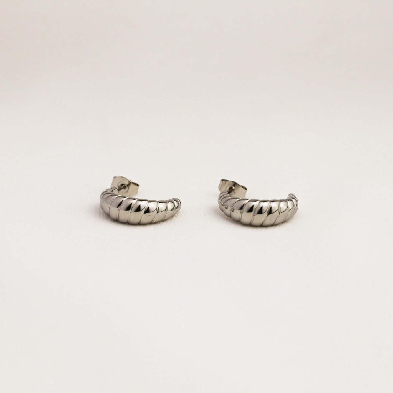 A pair of silver earrings