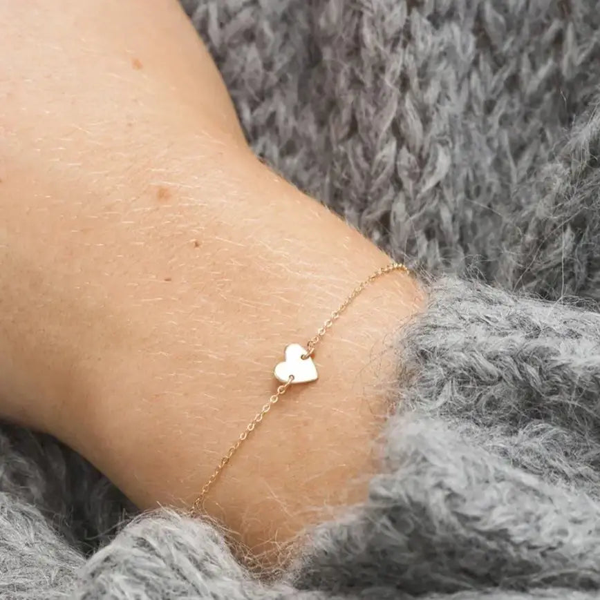 Gold chain bracelet with a heart