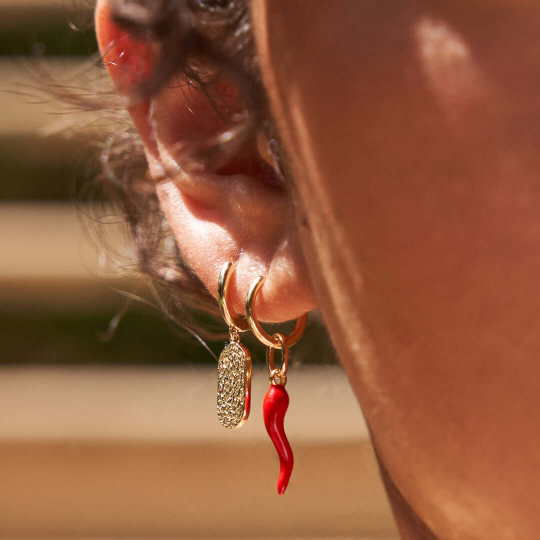 Model wearing funky Red chilli earrings stack