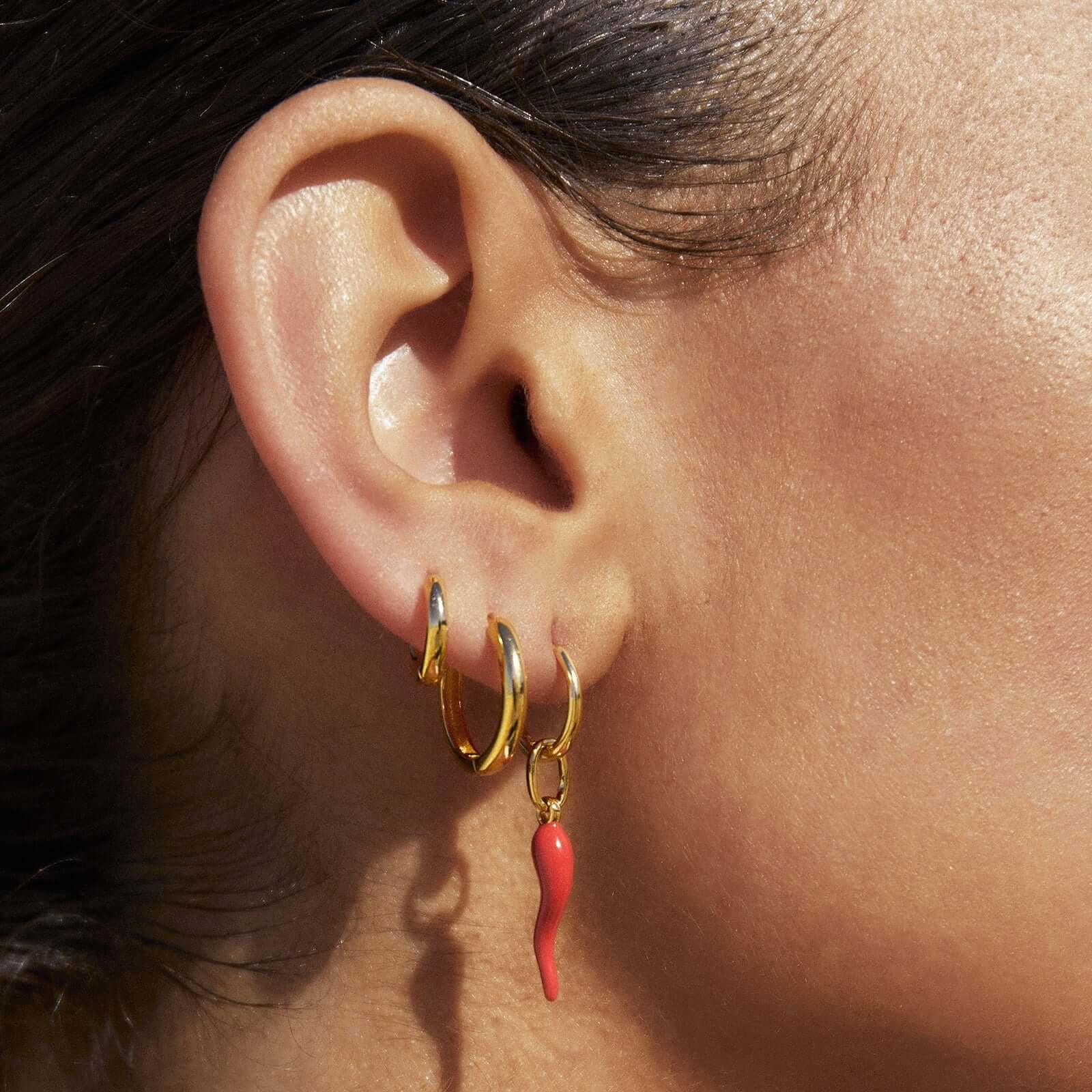 Model wearing funky Red chilli earrings stack