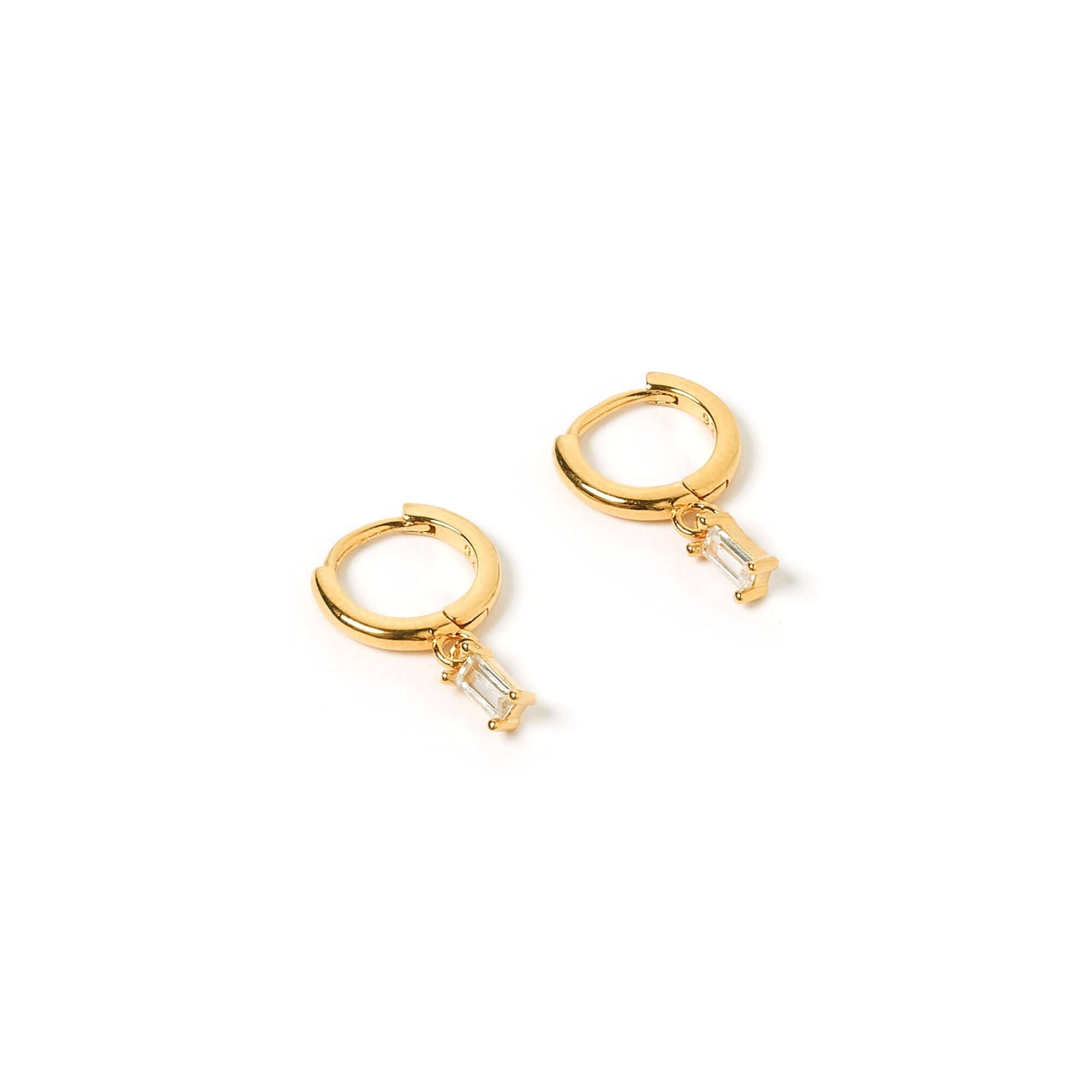 A pair of gold charm earrings