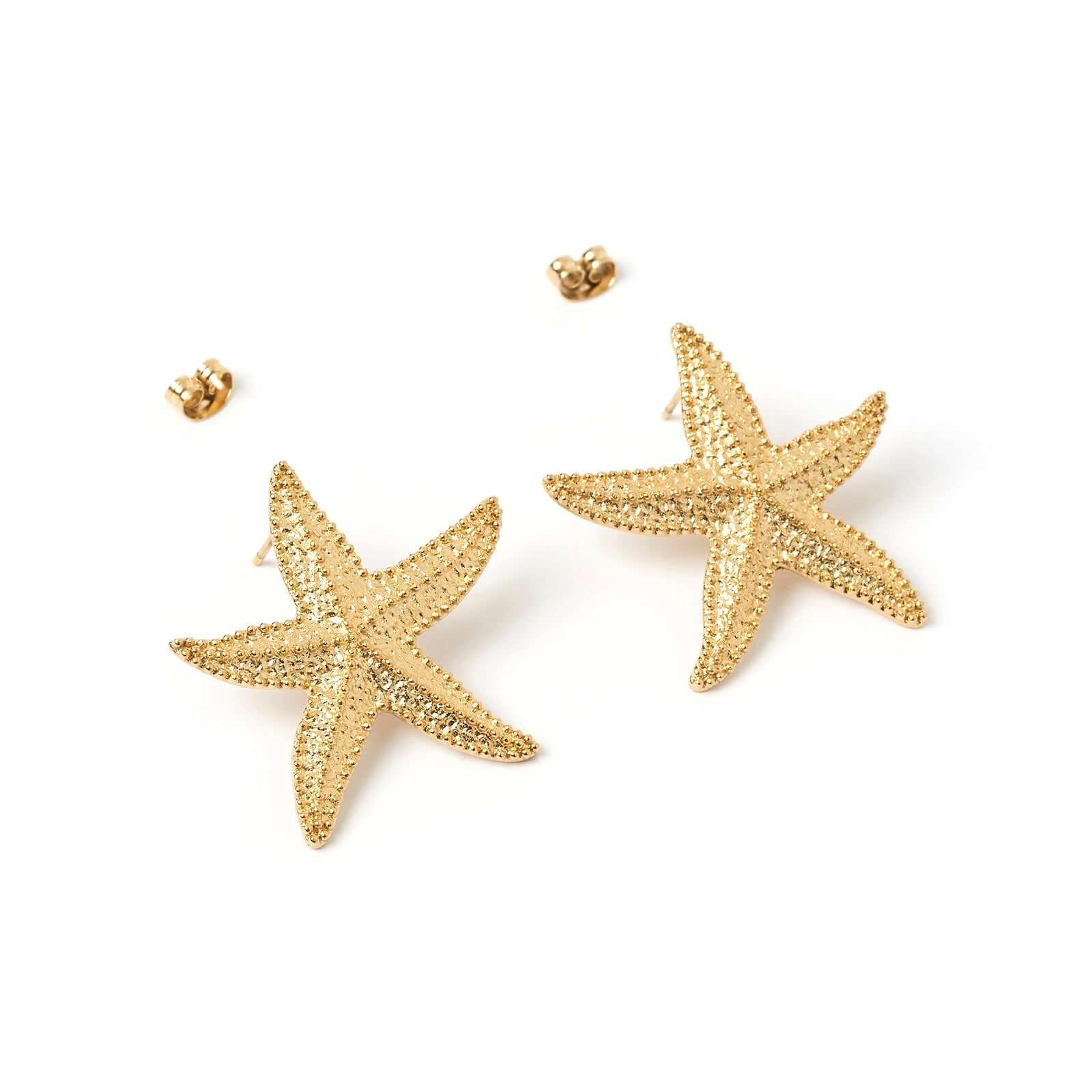 A pair of gold starfish earrings