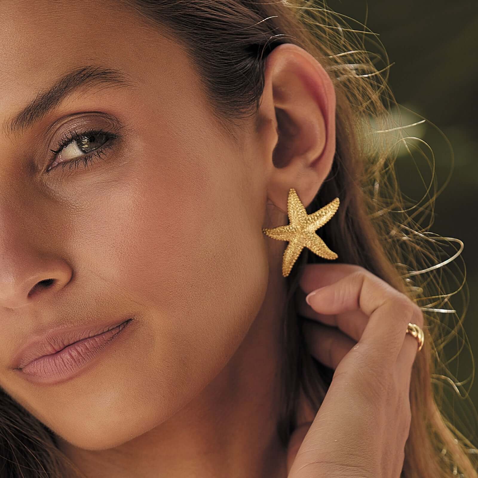 Model wearing Gold Starfish Earrings