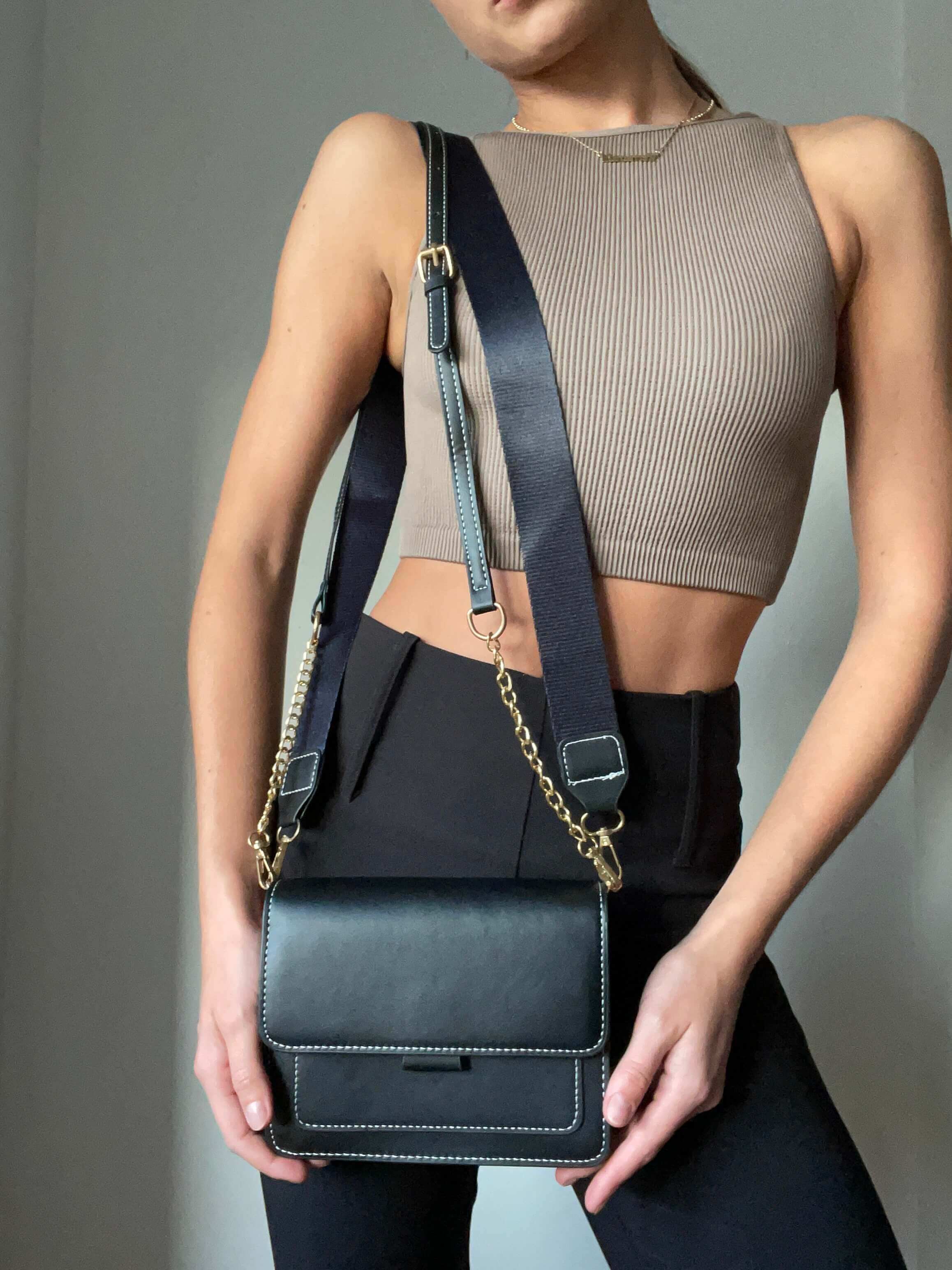 Model carrying Black Crossbody Handbag