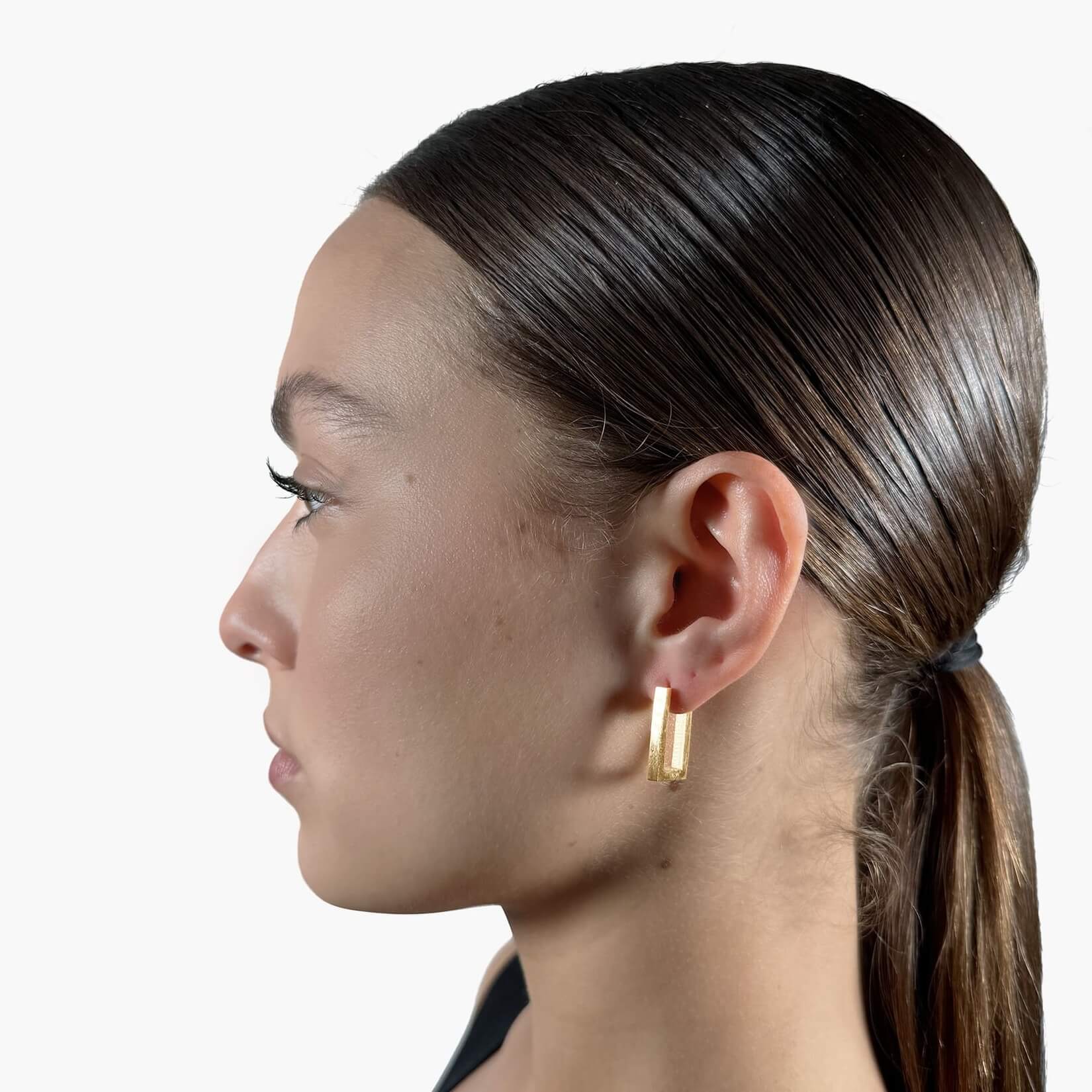 Model wearing Square hoop earrings