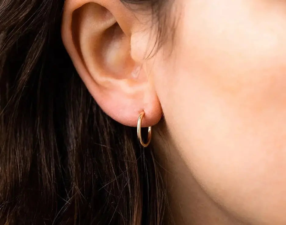 Model wearing Gold Hoop Earrings