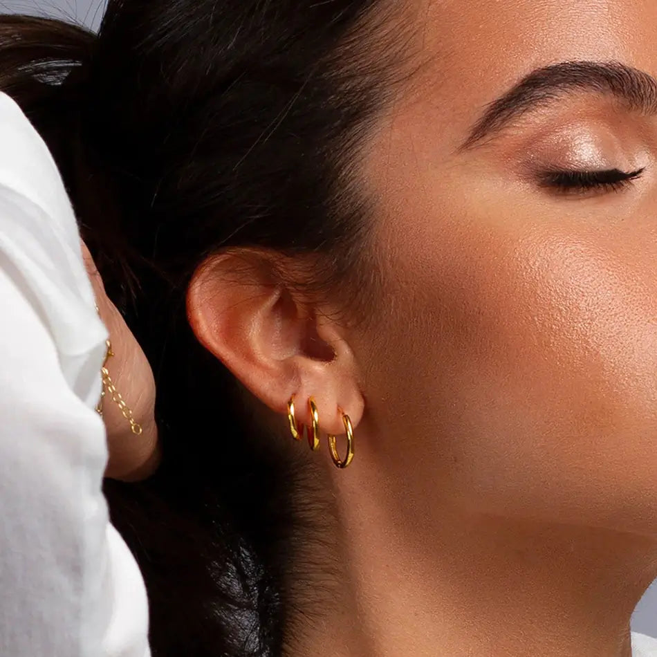 Model wearing Gold Hoop Earrings