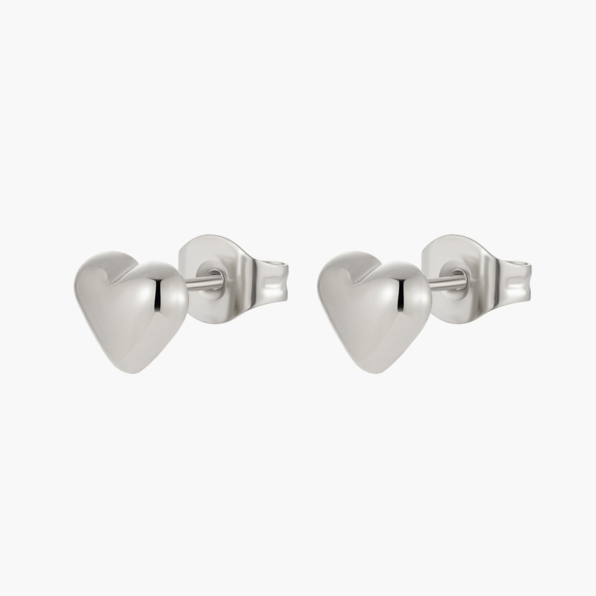 A pair of heart shaped silver earrings