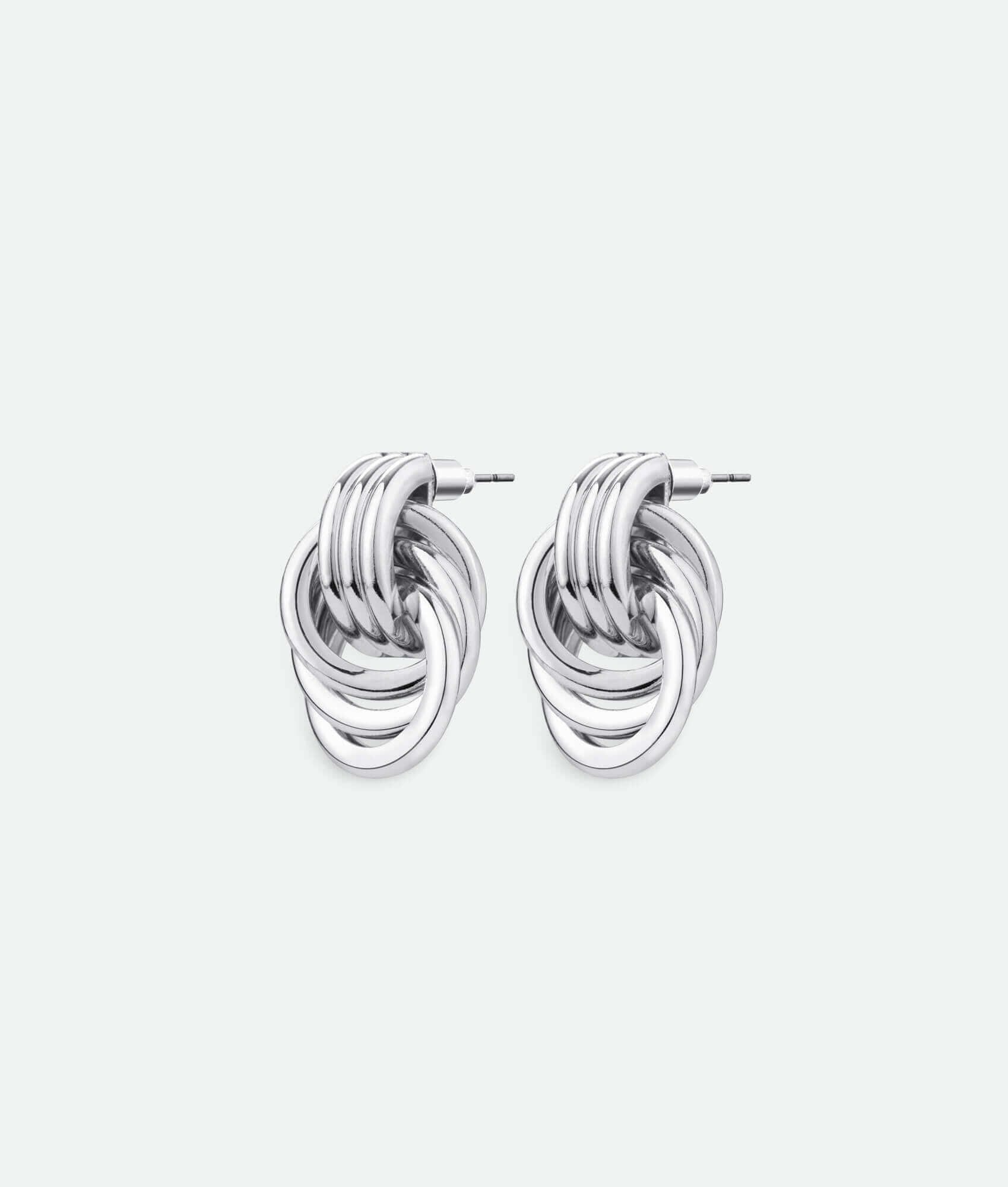 A pair of silver knot earrings