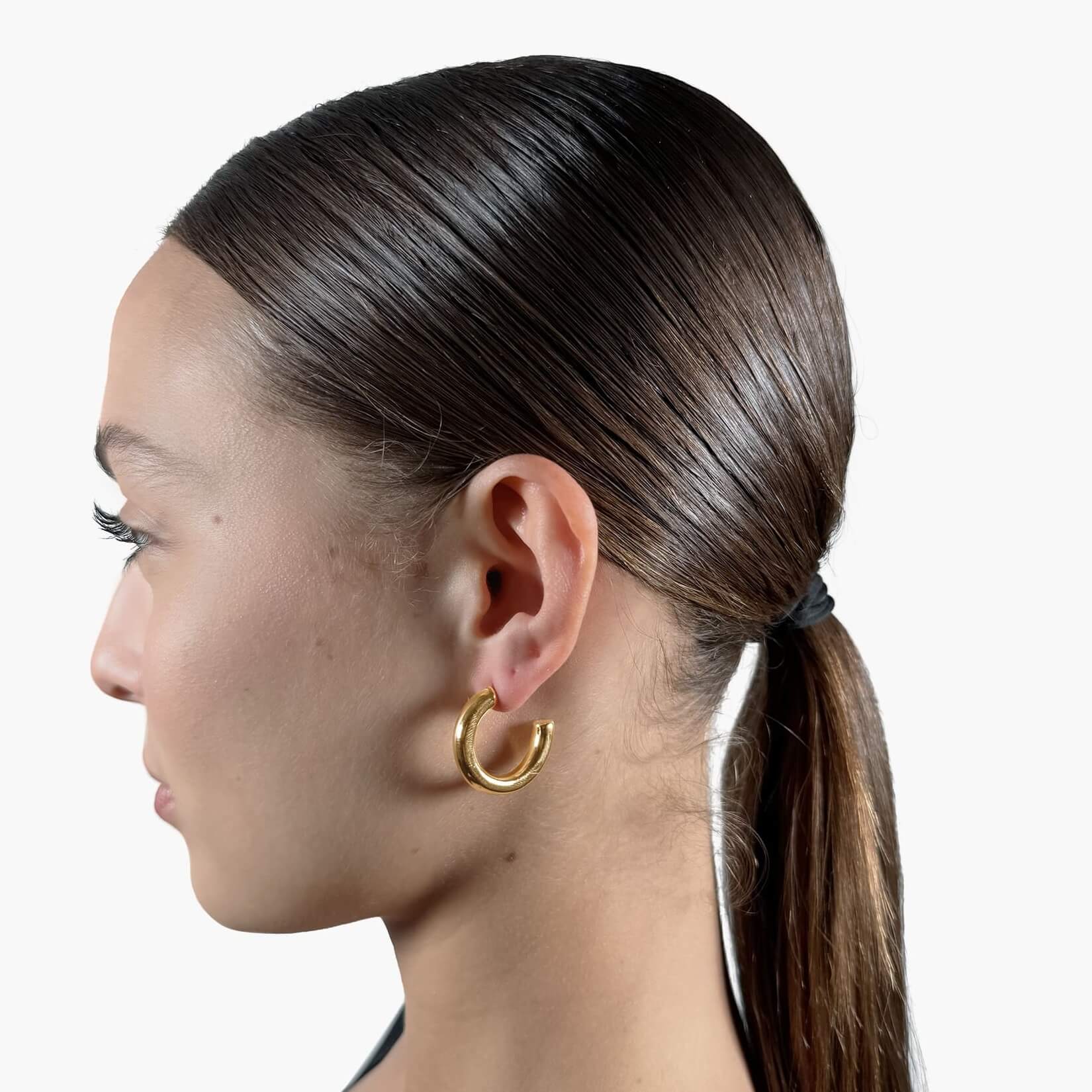 Model wearing Gold Open Hoop Earrings