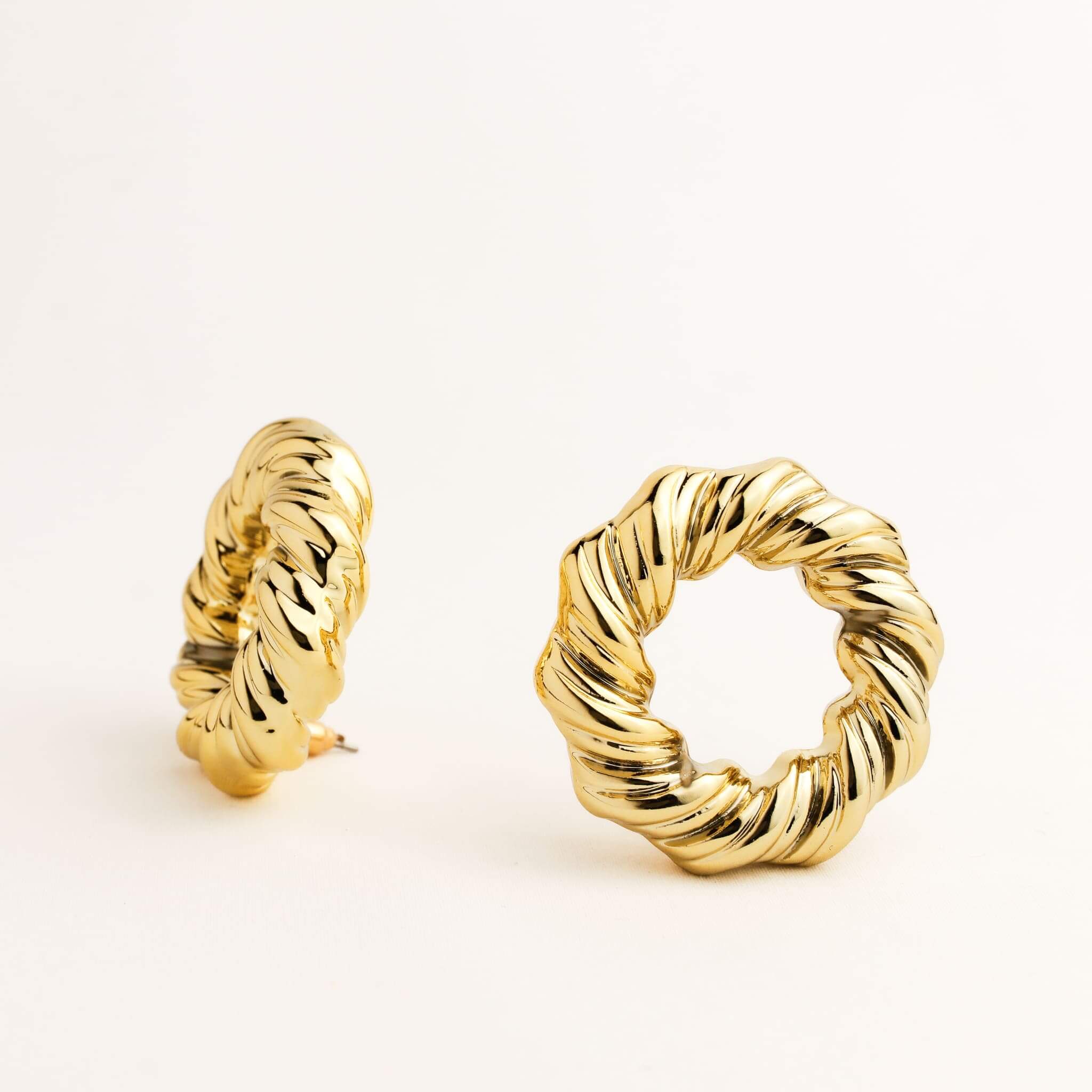 A pair of gold hoop earrings