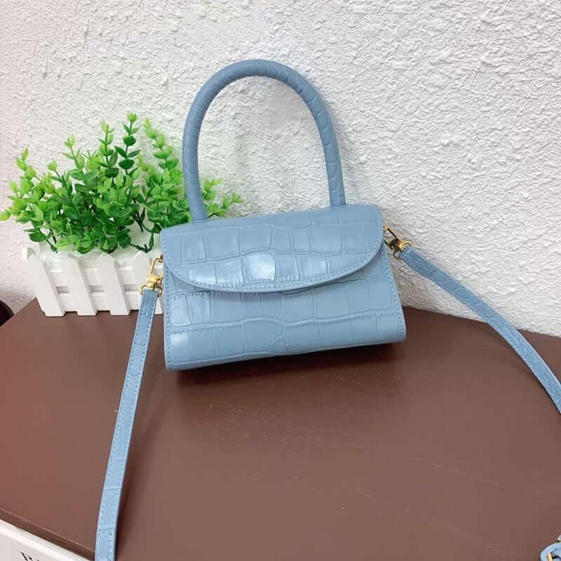 A light blue mini crossbody bag