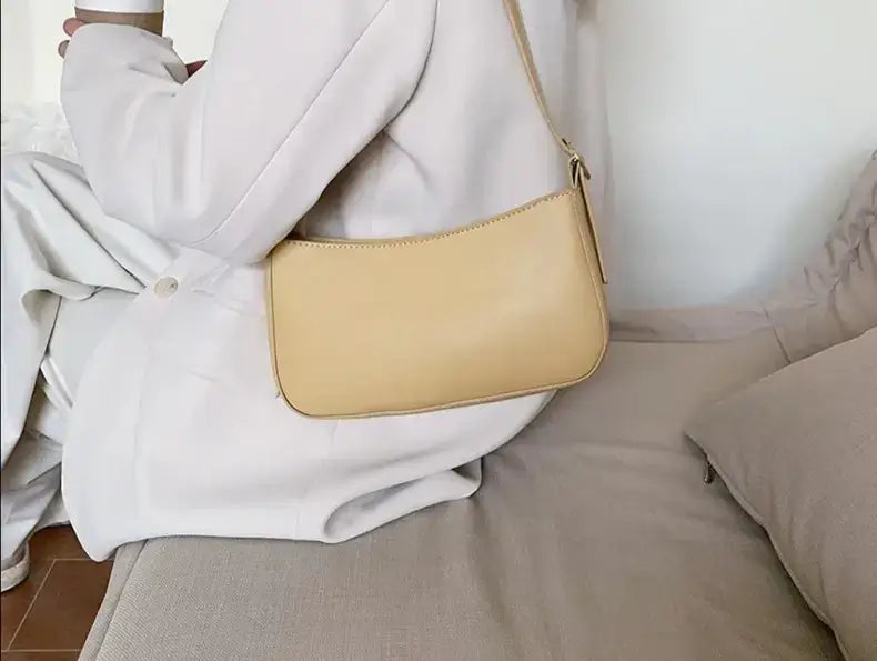 Woman carrying a Beige shoulder purse