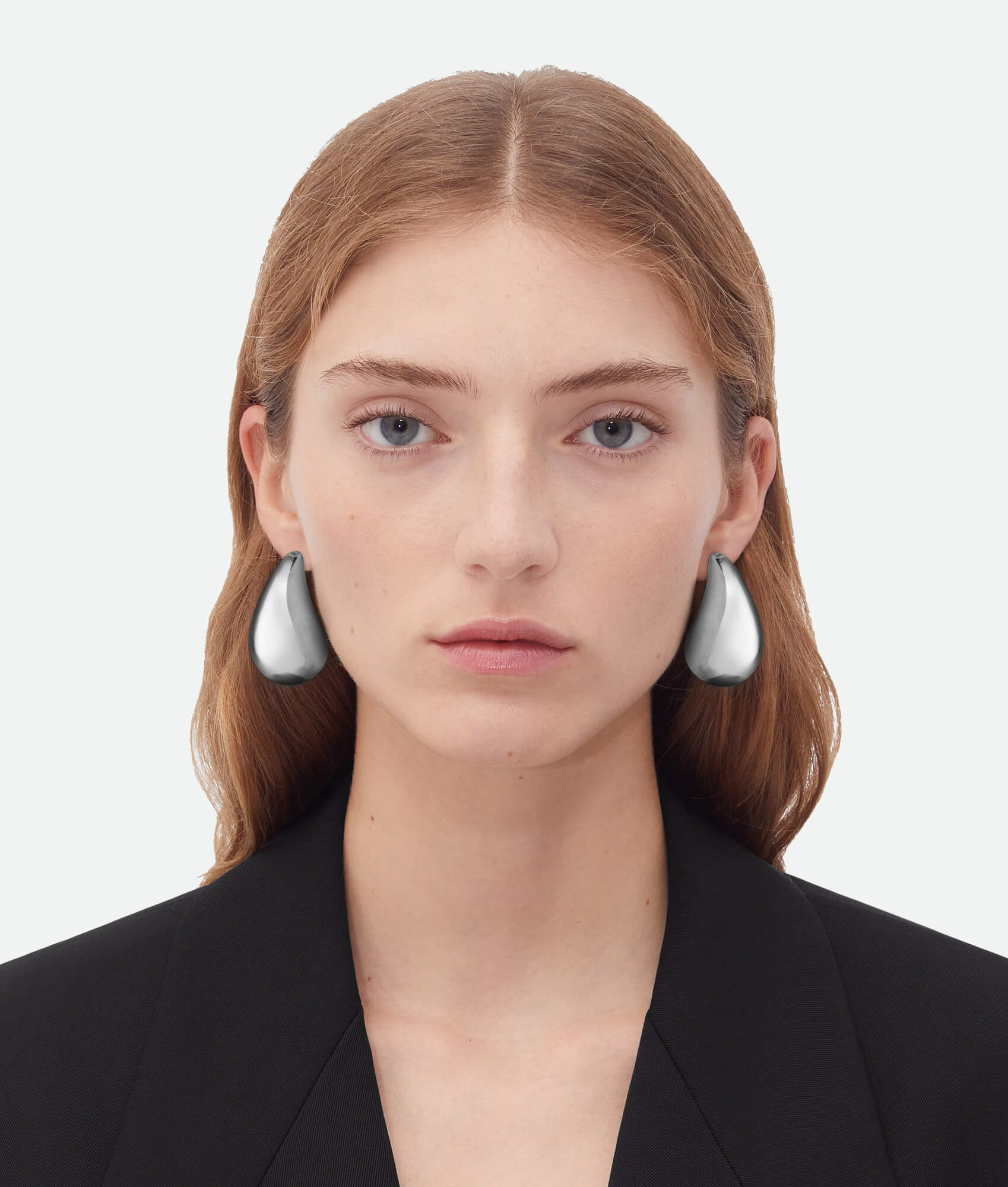 Model wearing Bottega drop earrings silver