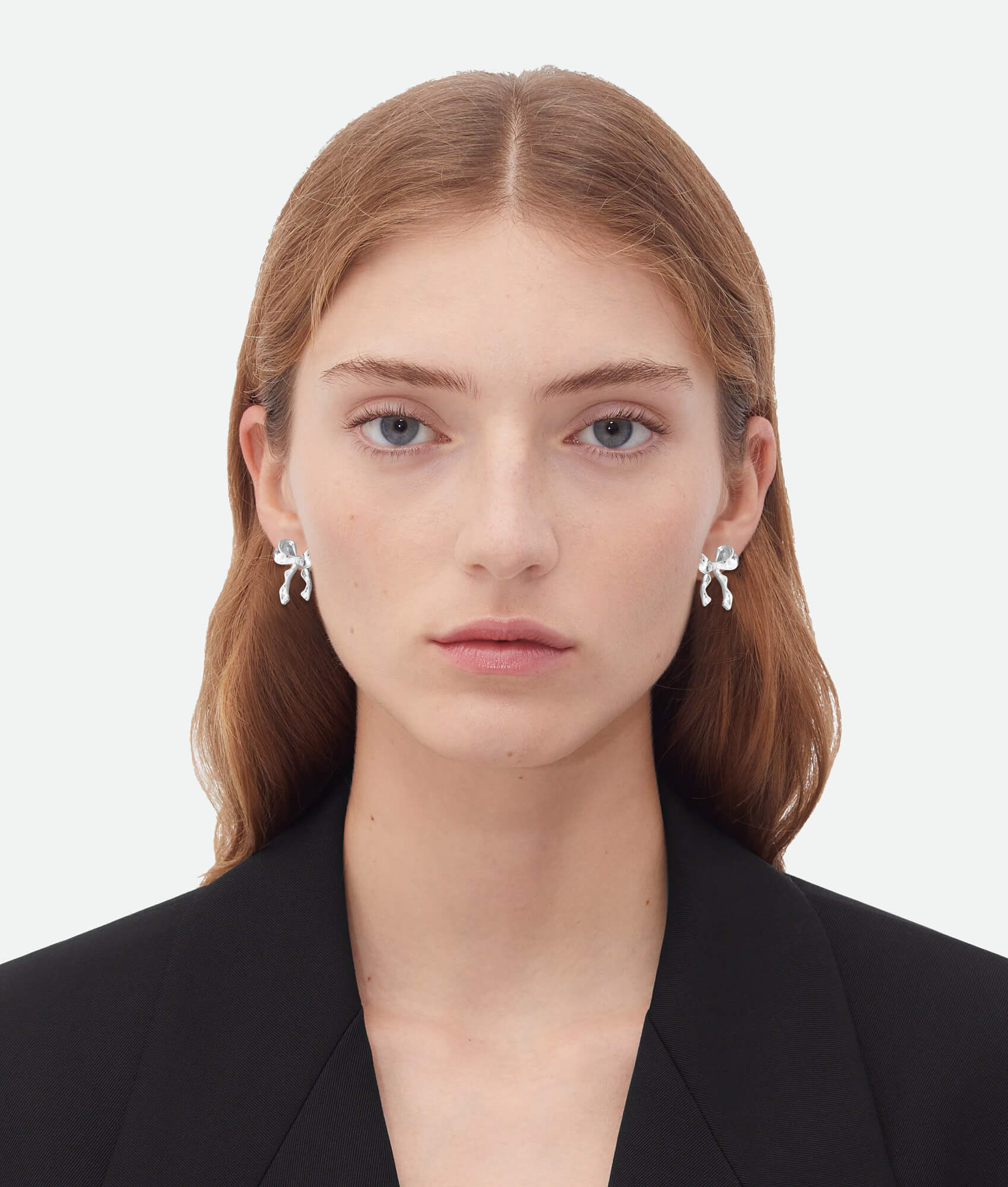 Model wearing Silver bow earrings